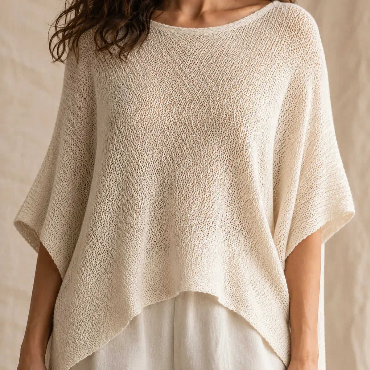 Solvera – Open Knit Batwing Top with Asymmetric Hem
